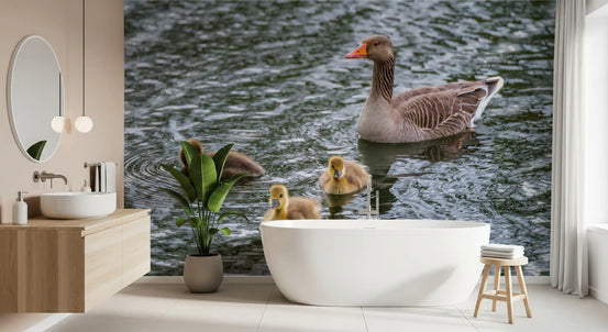 Greylag goose pond wall mural filling a bright bathroom with a freestanding tub GD12838