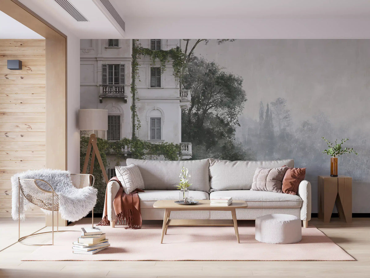 Grey sofa and gold accent chair against a misty botanical architectural mural GD12884