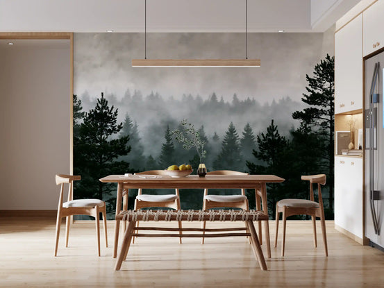 Misty pine forest wall mural in a dining room with a wood table and cream chairs GD12920