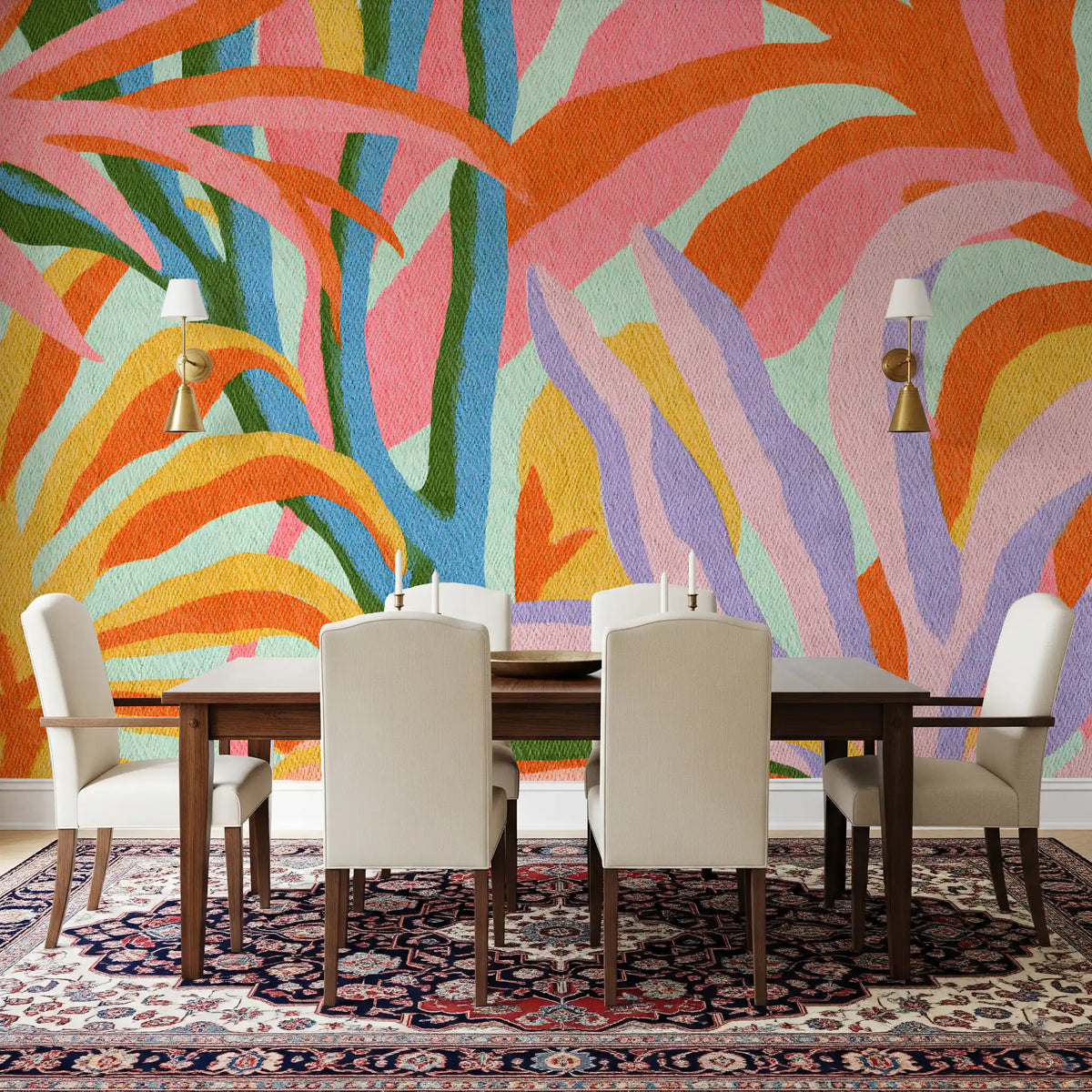 Colorful abstract botanical foliage wall mural behind a wood dining table with cream chairs GD12925