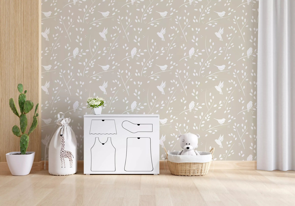 Soft taupe garden birds wallpaper in a nursery with a giraffe toy and teddy basket GD12940