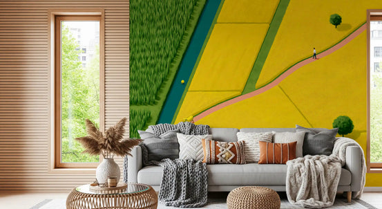 Golden fields and winding stream mural behind a grey sofa with boho pillows GD12974