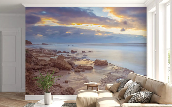 Coastal wallpaper in a living room with a beige sofa and a plant GD13037