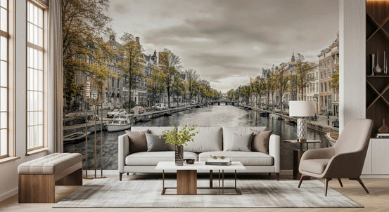 City wallpaper of a Dutch canal behind a cream sofa in a living room GD13043