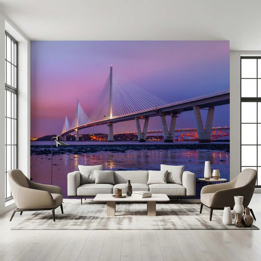 Architectural wallpaper of a twilight bridge behind a cream sofa and two lounge chairs GD13136