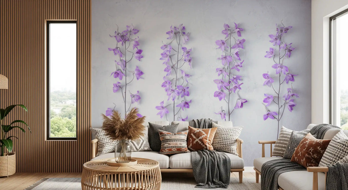 Lavender wallpaper above a cream sofa with patterned cushions and a rattan side table GD13138