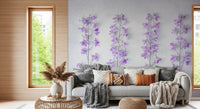 Lavender wallpaper behind a gray sofa with knit throws, pampas grass and a rattan table GD13138