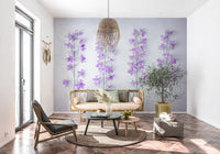 Delphinium wall design in a sunroom with a rattan sofa, black lounge chair and tile floor GD13138