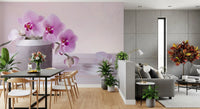 Orchid mural in an open plan room with a black dining table and gray sofa GD13139