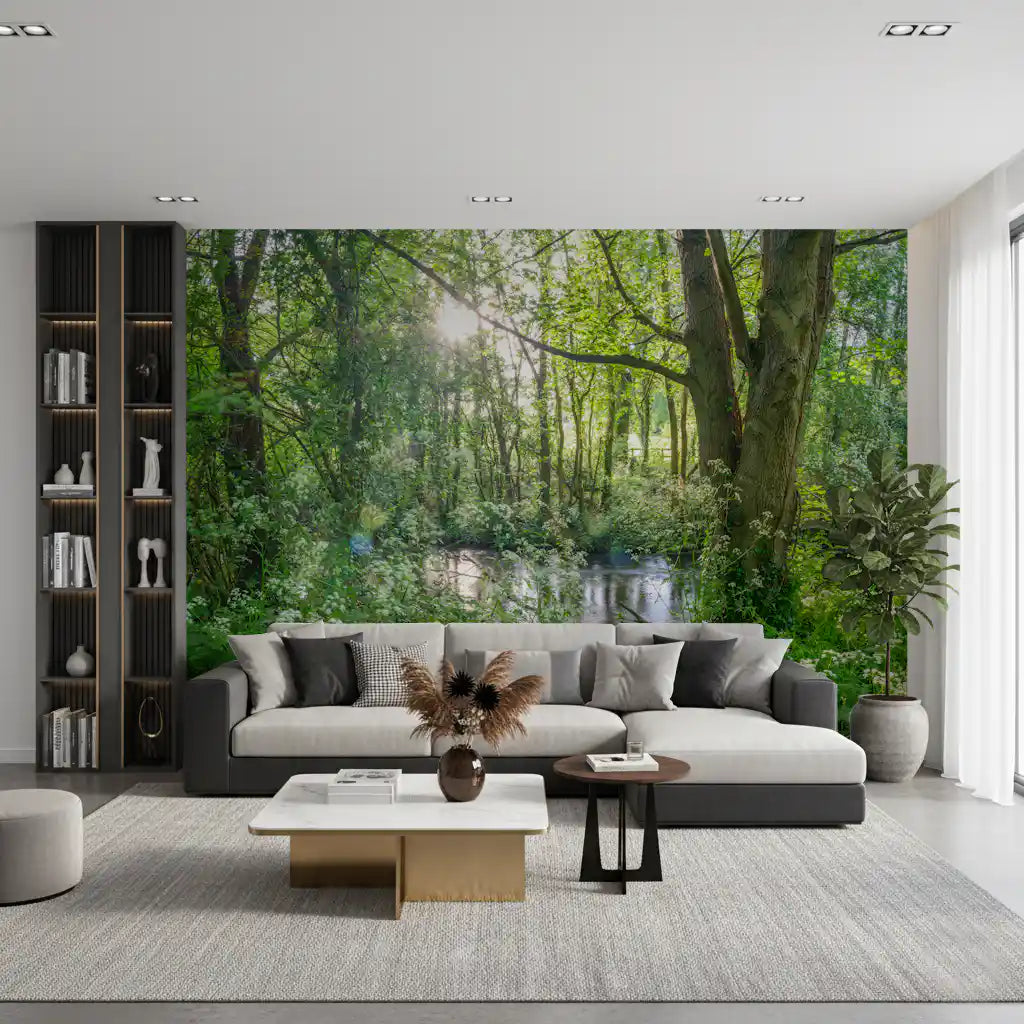 Forest wallpaper mural behind a grey sectional sofa and white coffee table GD13402