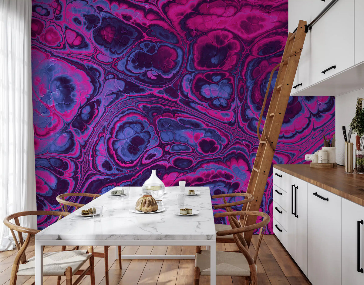 Pink and blue fluid art mural in a kitchen with a white marble dining table and wooden ladder GD13427