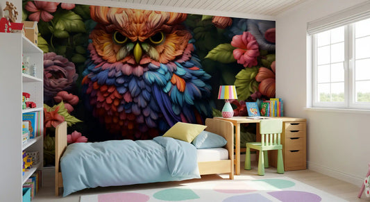 Rainbow owl mural behind a bed with light blue bedding, wooden desk and green chair GD13468