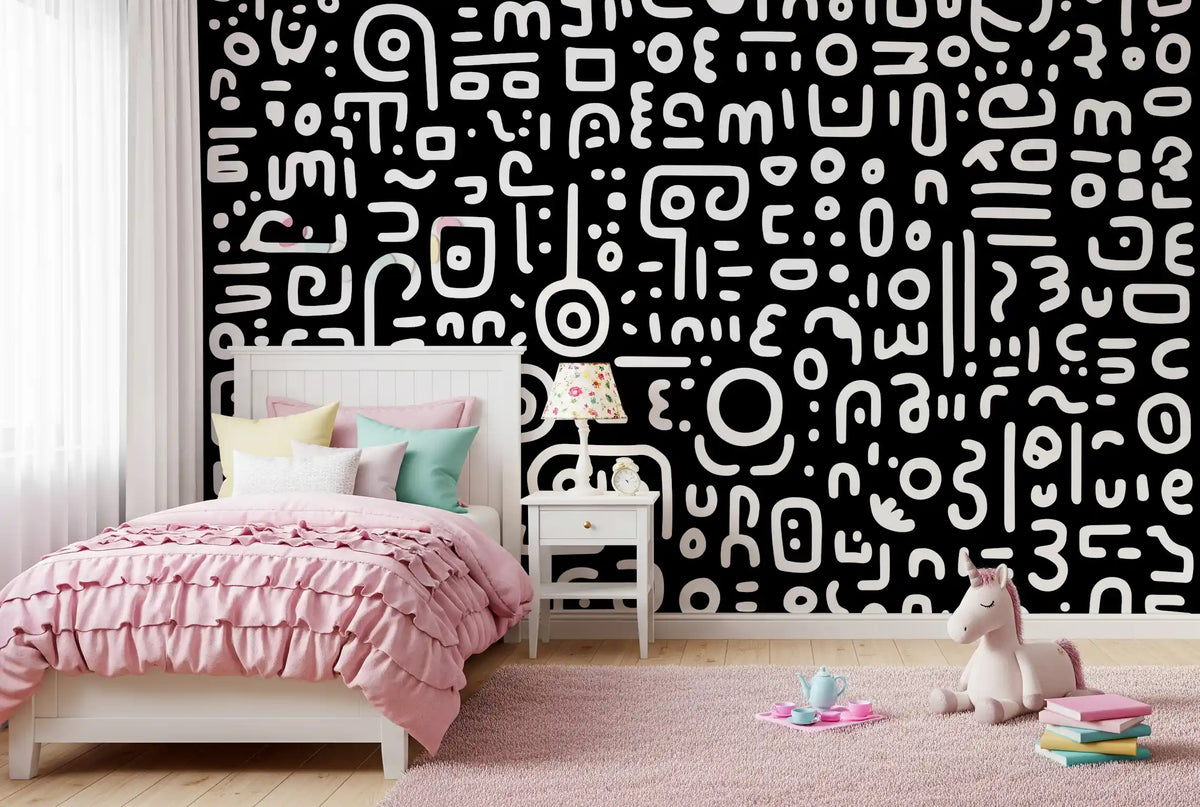 Girls bedroom with a pink ruffled bed and toy unicorn against black and white wallpaper GD13624