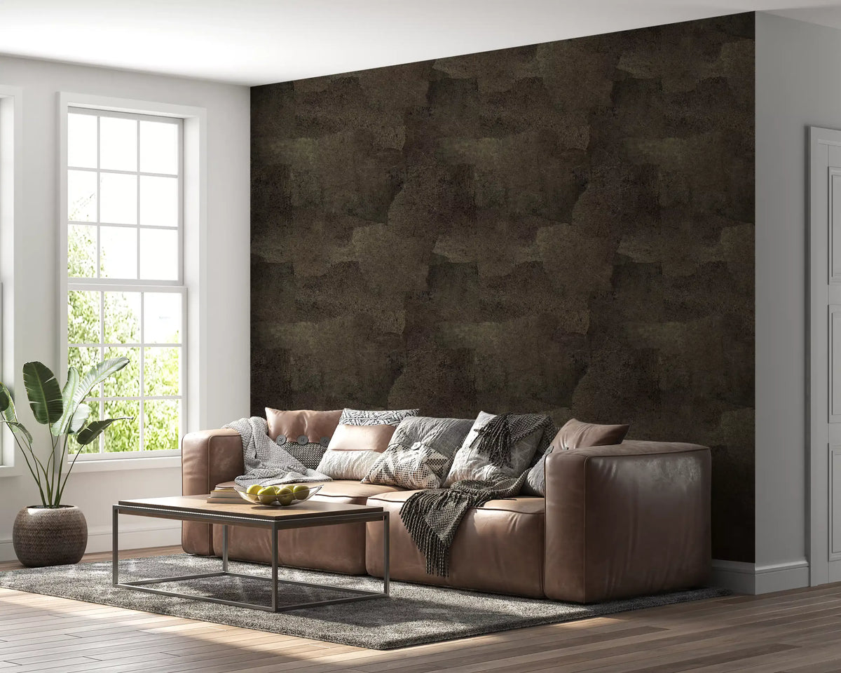 Brown wallpaper with torn leather texture behind a tan leather sofa in a bright living room GD13744
