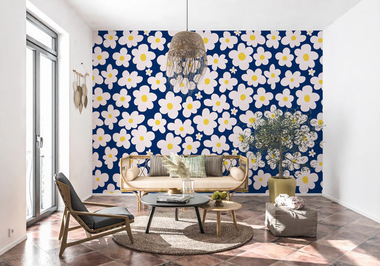 Living room with cane sofa, rattan pendant and terracotta floor on navy daisy wallpaper GD13770
