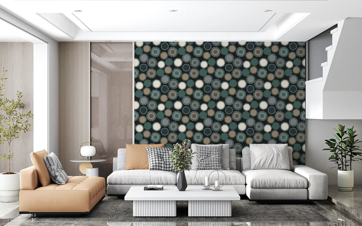 Geometric wallpaper behind a white sectional, tan leather armchair and white table GD13875