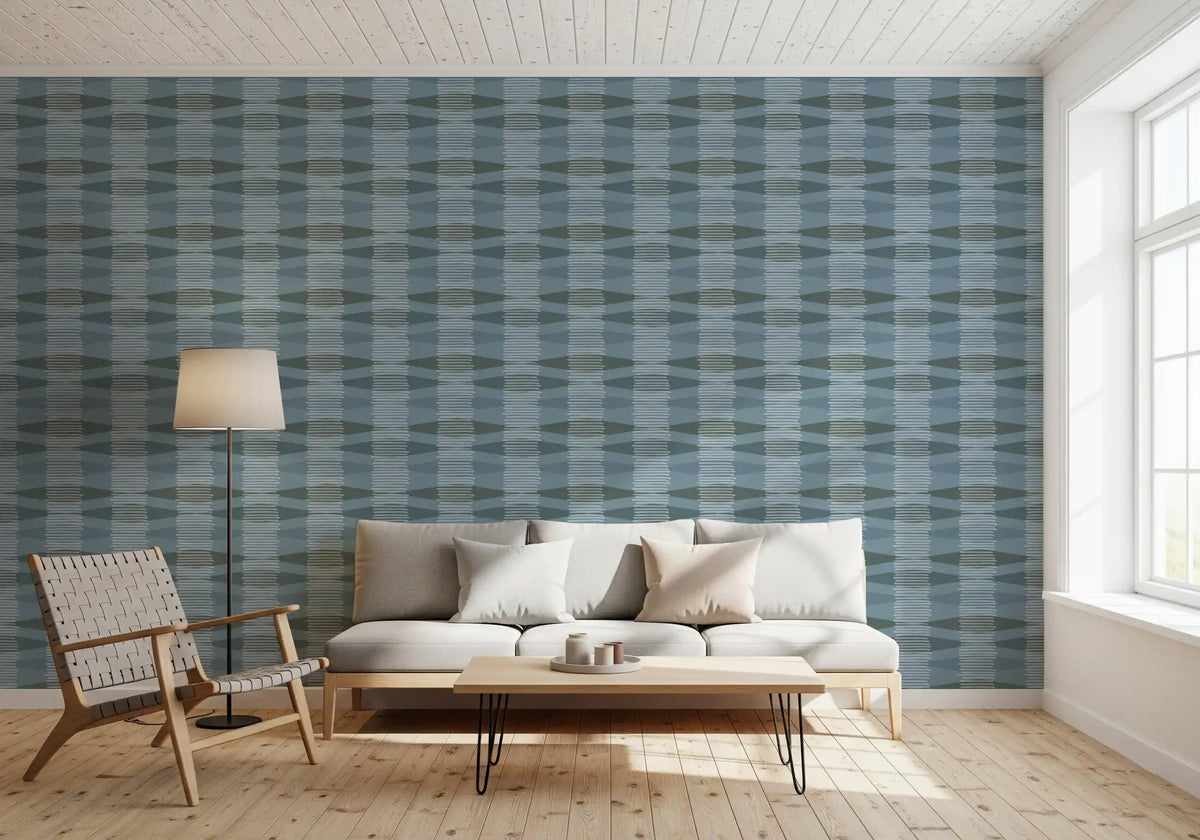 Coastal blue geometric wallpaper behind a white sofa and woven armchair GD13951