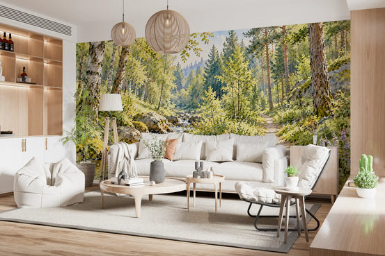 Watercolor wallpaper forest stream mural behind a white sofa and wood shelves in a bright living room GD13978