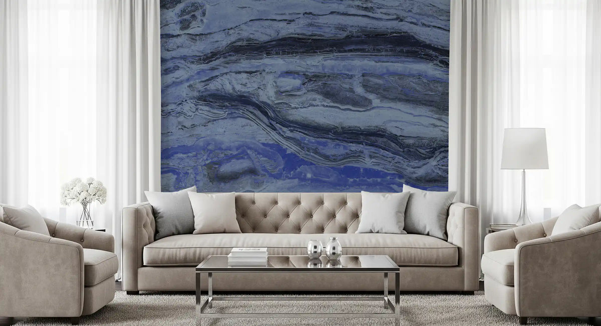 Tufted beige sofa and glass coffee table against a midnight blue marble mural GD13998