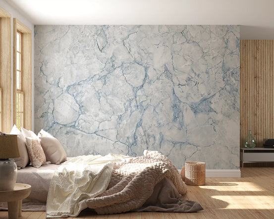 Blue vein marble wallpaper behind a bed with a knitted throw and wood panels GD14004