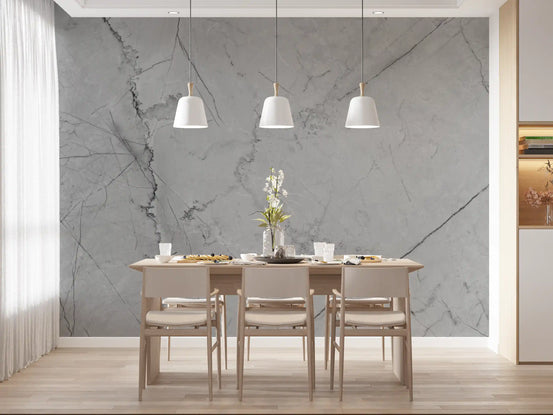 Gray marble wallpaper behind a light oak dining table with three white pendant lamps GD14020