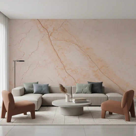 Peach marble wallpaper behind a cream sectional sofa and two rust brown armchairs GD14021