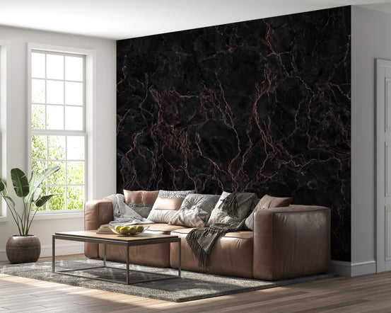 Dark marble wallpaper behind a brown leather sofa and metal coffee table by a window GD14023