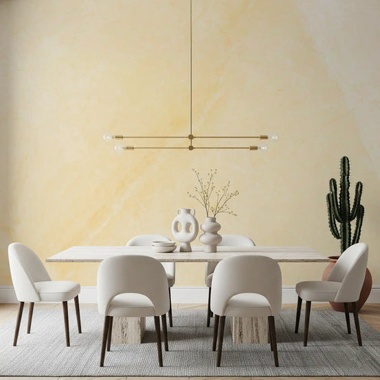 Dining room with white table, cream chairs and brass pendant on cream marble wallpaper GD14037
