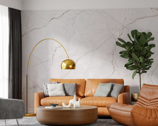 Marble wallpaper mural behind tan leather sofa, gold arc lamp and fiddle leaf fig GD14042