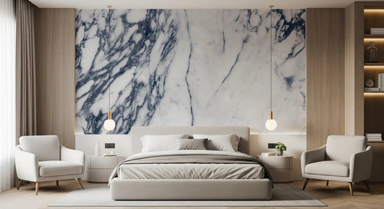Navy veined marble wallpaper mural behind beige bed and cream armchairs GD14089