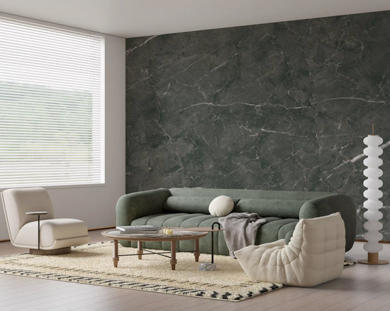 Charcoal marble wallpaper behind a green curved sofa, lounge chair and bobble lamp GD14123