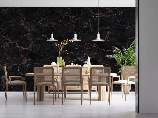 Dining room with cane back chairs, light wood table and three white pendants on marble wallpaper GD14137