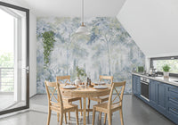 Forest wallpaper in a kitchen with round wood table, cross back chairs and navy cabinets GD14181