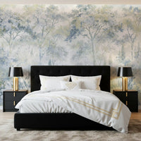 Forest wallpaper behind a black tufted bed with gold lamps and black nightstands GD14181