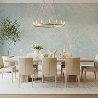 Long dining table with cream chairs and gold ring chandelier on marble wallpaper GD14187