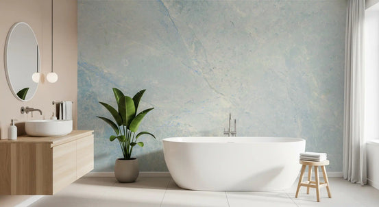 Bathroom with freestanding white tub, oak vanity and round mirror on marble wallpaper GD14188