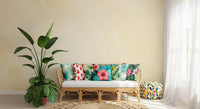 Rattan bench with tropical print cushions and bird of paradise plant on marble wallpaper GD14189