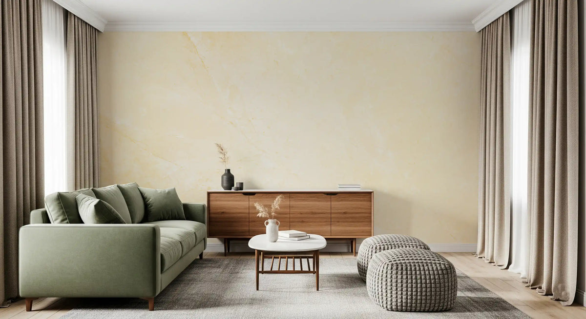 Sage green sofa, walnut sideboard and knit poufs against a cream marble feature wall GD14189