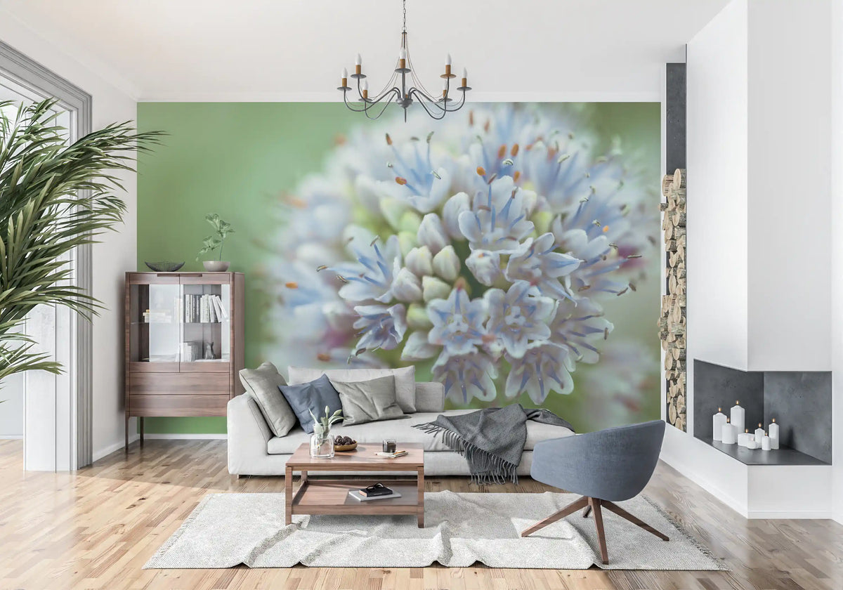 Floral wallpaper mural of a blue allium behind a light sofa and gray swivel chair GD14202