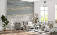 Marble wallpaper in a bright living room with gray sofa and striped rug GD14204