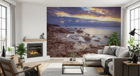 Beach wallpaper in a living room with fireplace, gray sectional and tall windows GD14207