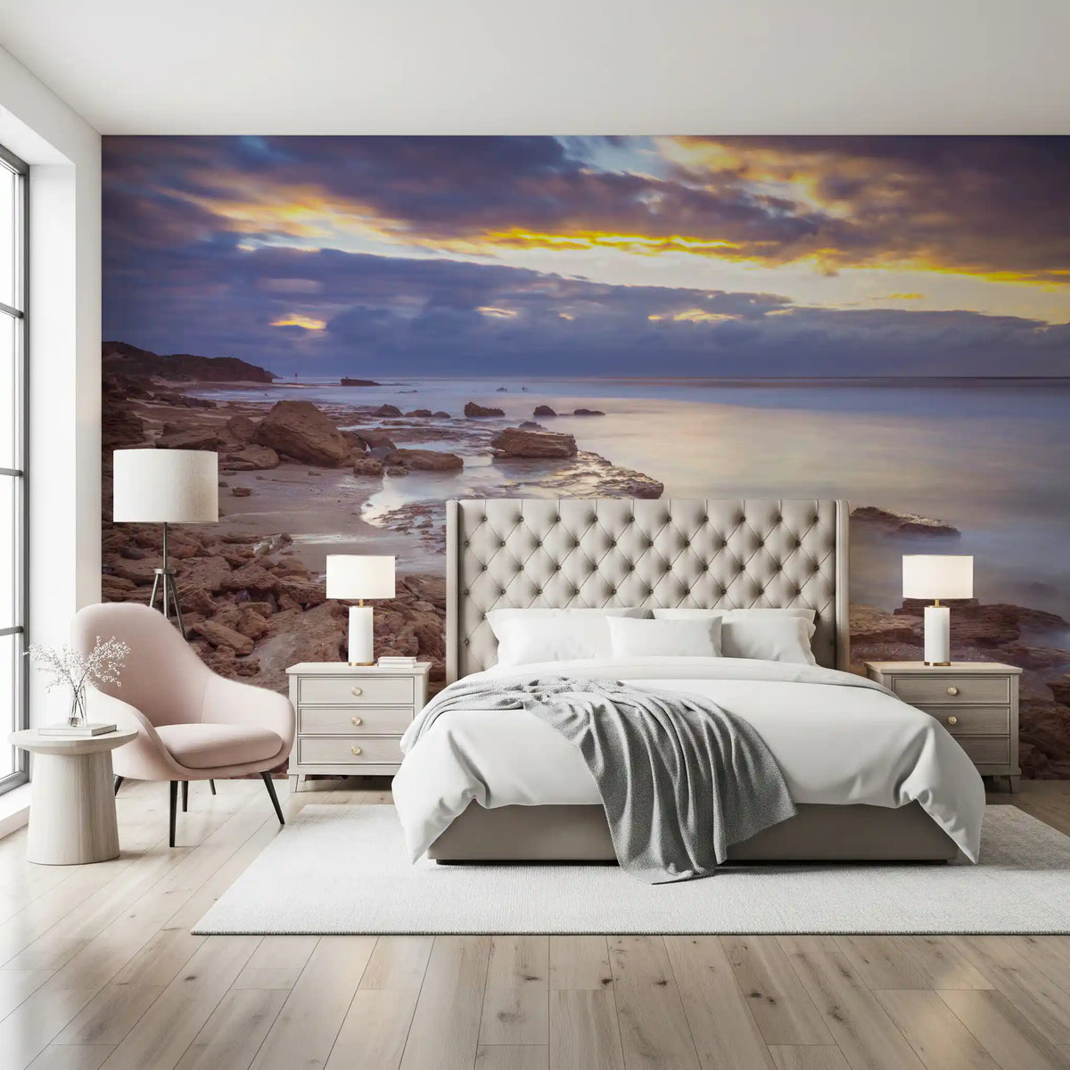 Bedroom with tufted headboard and pink accent chair under a purple sky shore GD14207