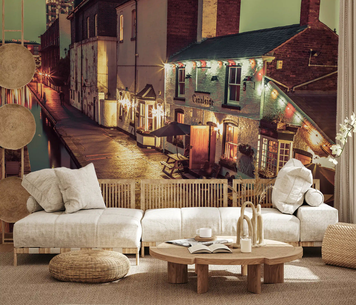 Cream sofa, round wood coffee table and wall baskets with an evening canal mural GD14208