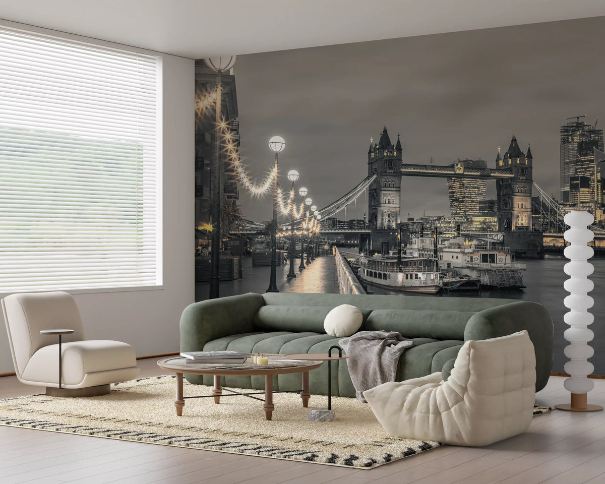 London wallpaper behind a green velvet sofa and white boucle chairs in a living room GD14214