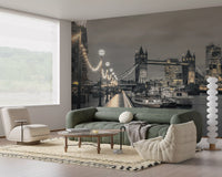 London wallpaper behind a green velvet sofa and white boucle chairs in a living room GD14214