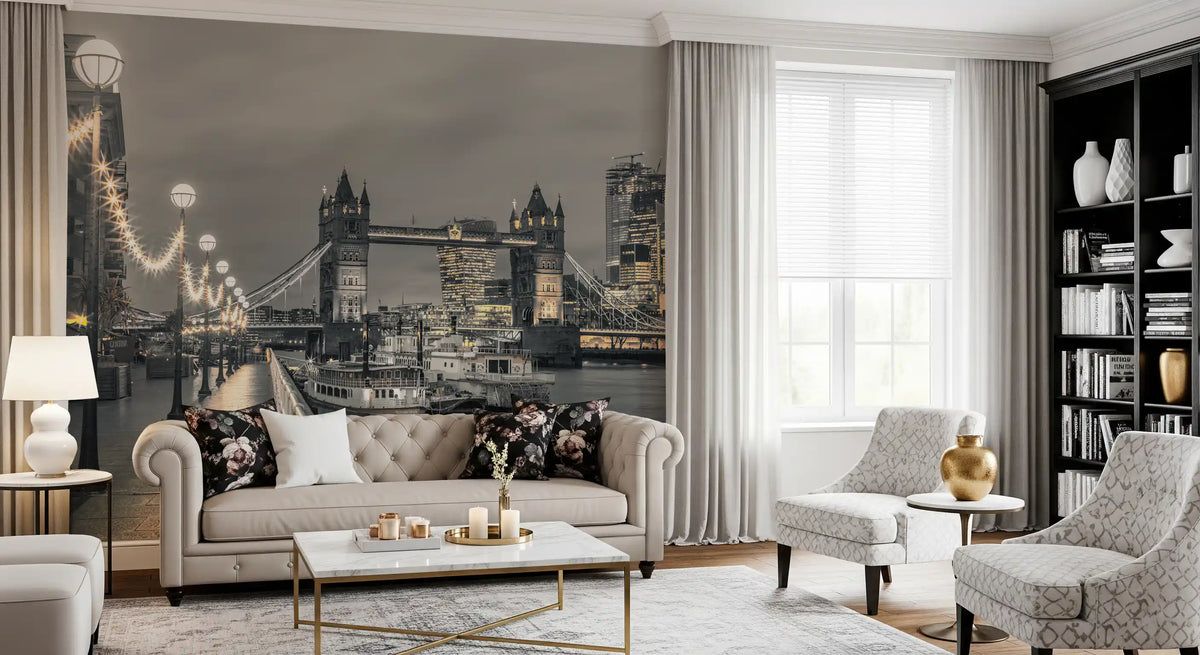 London wallpaper behind a tufted beige sofa with floral cushions and gray armchairs GD14214