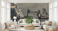 Tower Bridge mural behind a white sofa, wicker table and wooden armchairs GD14214