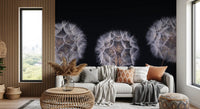 Gray sofa with orange cushions and rattan side table by a tall window on a seed head mural GD14218