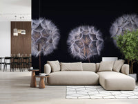 Beige sectional sofa and geometric rug with a dining area behind a dandelion seed head mural GD14218