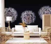 Cream sofa, rattan armchairs and round wood table in front of a monochrome seed head mural GD14218